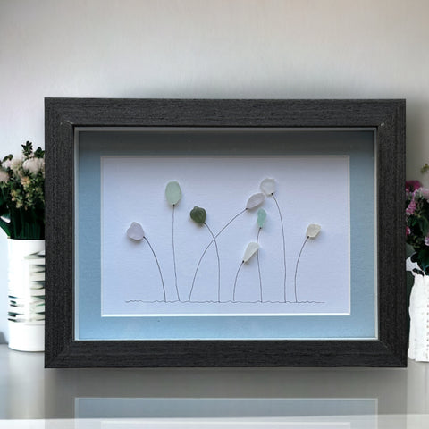 Arte de guijarros con imagen de jardín de flores multicolores de cristal marino