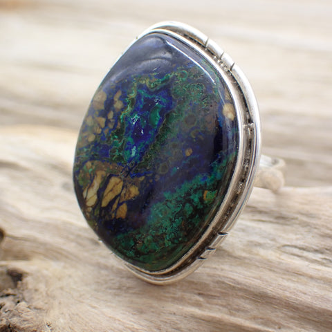 sterling silver blue and green azurite stone ring with edge detail on driftwood