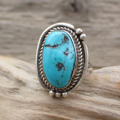 sterling silver turquoise ring on driftwood