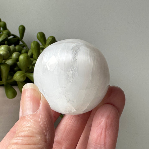 selenite stone sphere on stand